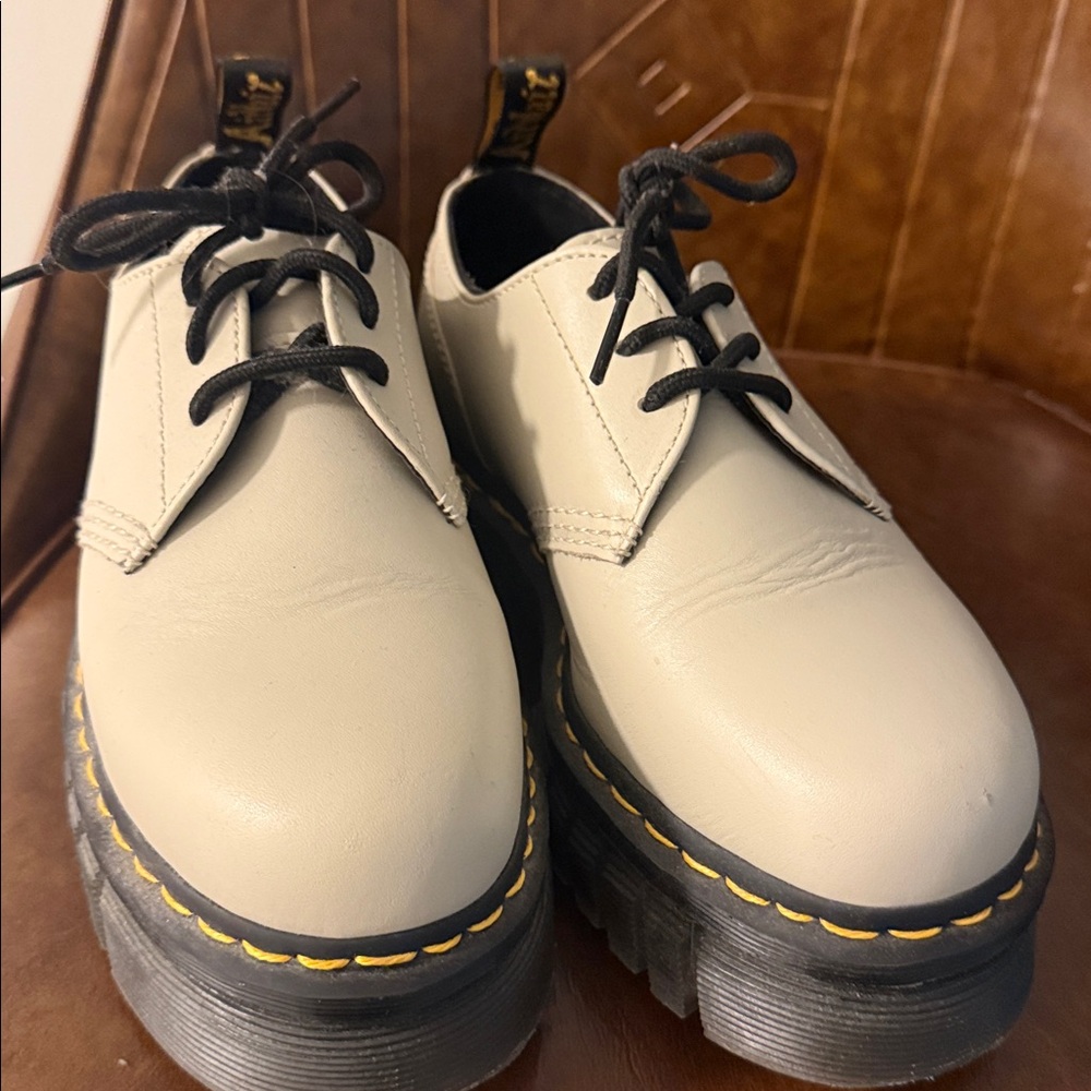 Dr. Martens ran Leather Shoes with Black Laces.
